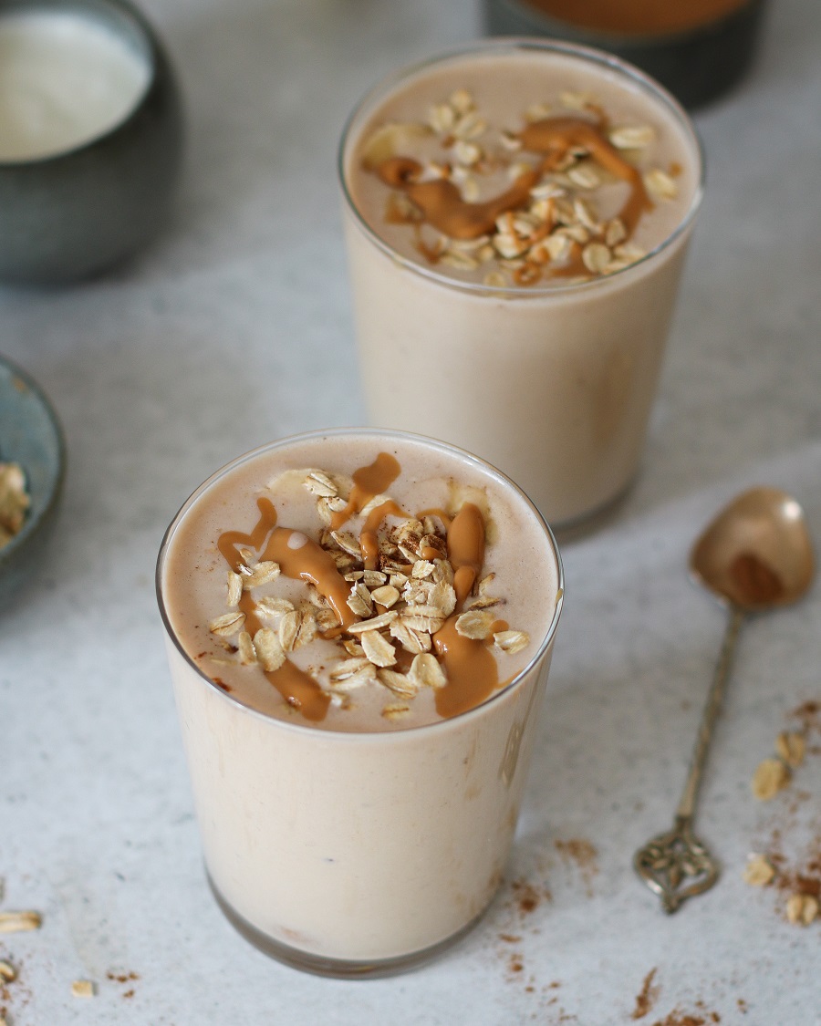 glass of banana and nut butter smoothie 